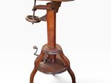 a wooden table with a metal base and a wooden top