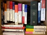 many books in the box on the shelf