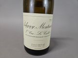 a bottle of wine that is sitting on a table