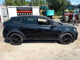 a picture of a black car parked in a lot