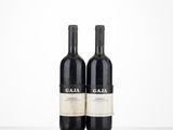 two bottles of red wine sitting on top of a table