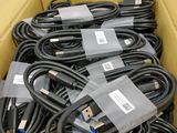a lot of cables in a box with labels on them