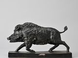 statue of a boar on a wooden base on a white background