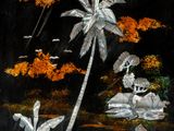 a painting on the wall of a building with a palm tree