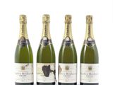 trois bouteilles de champagne posées les unes à côté des autres sur une surface blanche