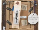 a picture of a picture of a wooden frame with tags on it