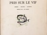 un vieux livre dont la couverture est ornée d'une illustration représentant un poisson