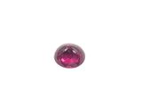 a close up of a pink sapphire stone on a white background