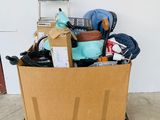 a cardboard box full of items in a garage