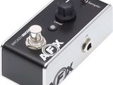a close up of a black and silver guitar pedal overdriver
