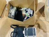 a lot of items that are in a box on the floor