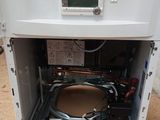 a white oven that is inside of a cardboard box