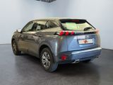 the rear end of a silver suv parked in a showroom