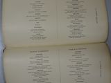 a book open on a table that has a list of items on it