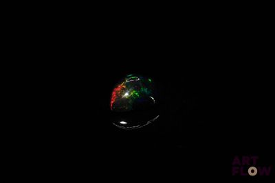 an image of a black background with a ring in the dark