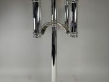 a silver candelab with three candles on top of it