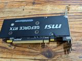 a close up of a video card sitting on top of a wooden table