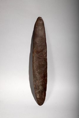 a cigar shaped object on a white surface