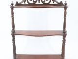 a wooden shelf with two shelves on each side of it