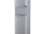 the water dispenser is standing on a white surface