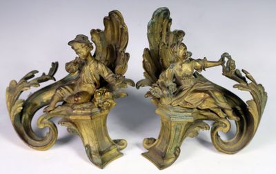 Paire de chenets en bronze doré patiné à décor d'enfants et …