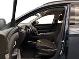 the interior of a car with the door open and the driver ' s seat down
