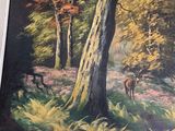 a picture of a painting of a deer in the woods