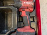 a red tool box with tools in it on the floor
