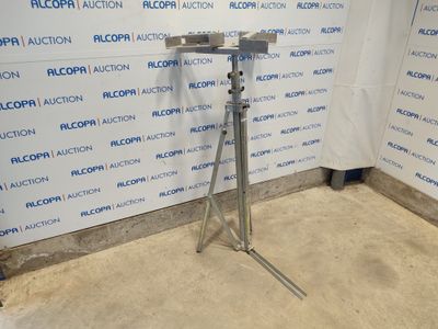 an image of a microphone on a tripod in front of a wall