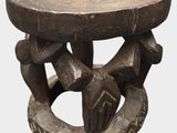 a wooden table with a carved design on top of it