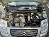 a car with its hood open and the engine in the trunk