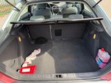 a trunk of a car with a lot of items in it