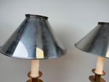 pair of metal lamps with wooden bases and a metal shade