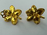 a pair of gold plated flower earrings