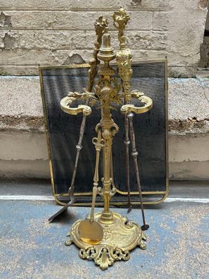 a gold plate on the ground with a mirror in front of it