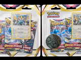 two packs of pokemon trading cards with a coin in each of them