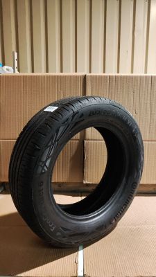 tires are stacked on a cardboard box in front of a cardboard box