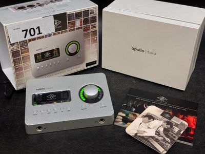 a white box with a black and white picture of a cassette player and a cd