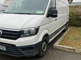 a white van that is parked in a parking lot