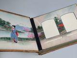 an open book with a picture of a woman holding an umbrella