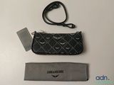 a close up of a purse with a lanyard and a lanyard strap
