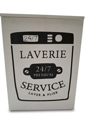 une pancarte indiquant « service de laverie » sur le devant d'une machine