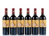 six bottles of red wine lined up in a row