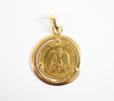a close up of a gold coin on a white surface