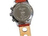 wrist watch with brown leather strap on white background with space for text