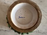 a small bowl sitting on top of a marble table