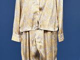 an image of a mannequin dressed in a gold suit