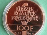 a close up of a coin on a green surface