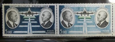 two stamps with a picture of two men and a plane on them