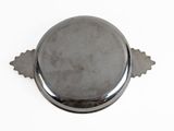 an image of a metal object on a white surface with a white background